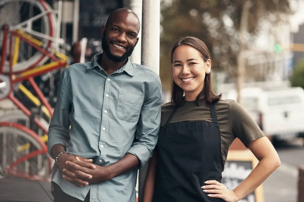 Man and woman clerk at bike shop.